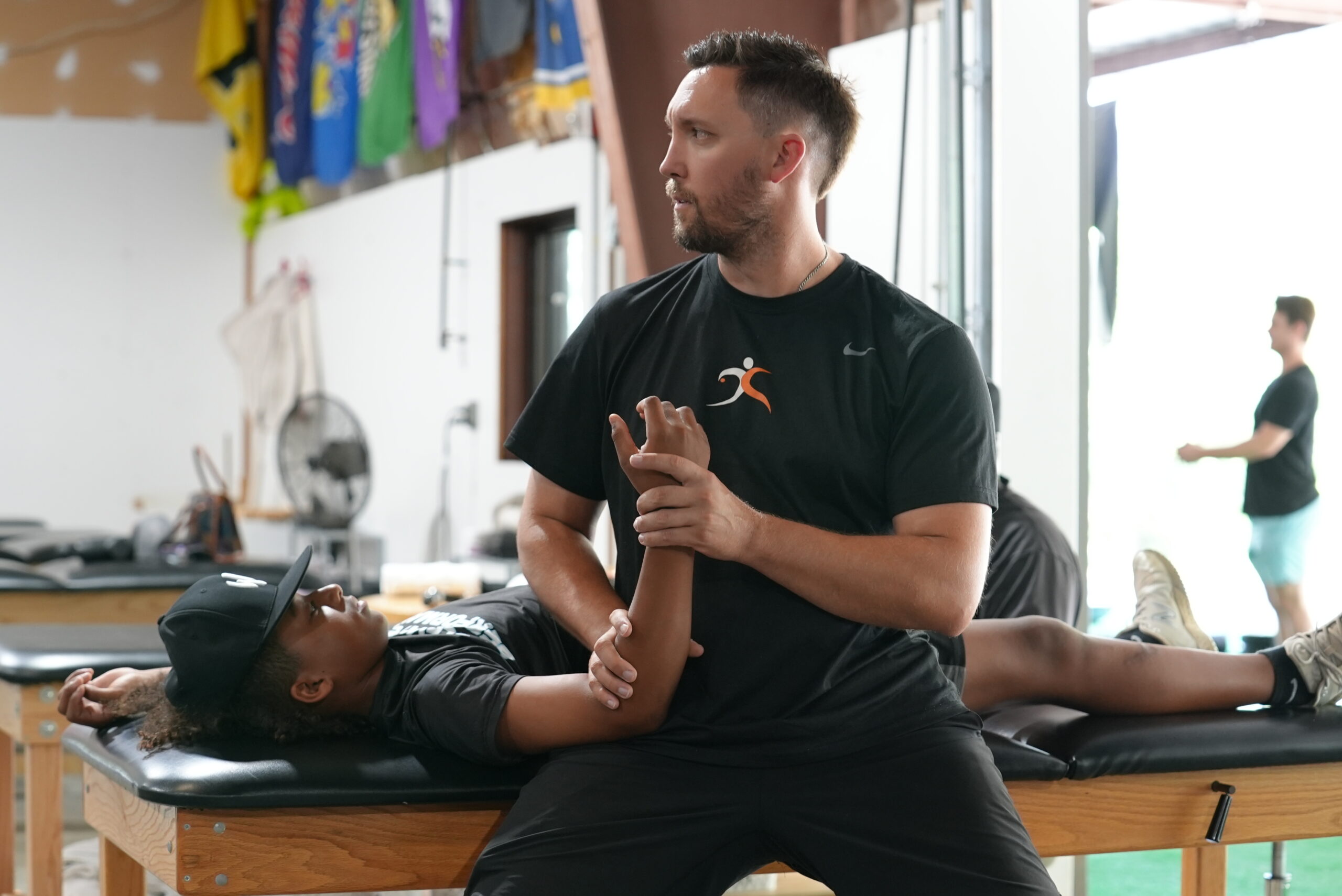 physical therapy on a patient's arm